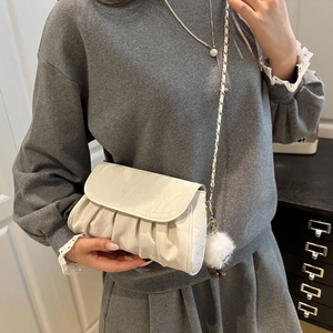 Fashionable creamy white pleated cloud shoulder bag with chain strap and plush charm