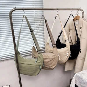Minimalist crescent moon crossbody bags in nylon shown in four stylish colors