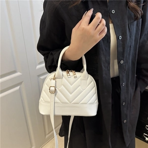 Fashionable white quilted shell handbag with gold hardware and adjustable strap for women