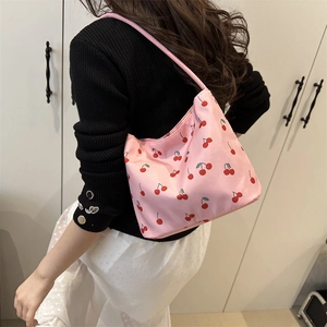 Pink nylon underarm tote bag with cherry print pattern for casual shoulder wear