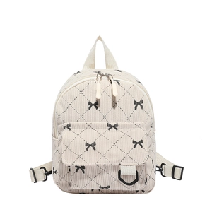 Mini corduroy backpack in beige with black bow print and quilted rhombus pattern