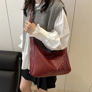 Chic burgundy tote bag with silver rivet M logo and shoulder strap for women