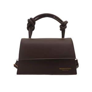 Dark brown trendy faux leather handbag for women featuring unique double-knot handles