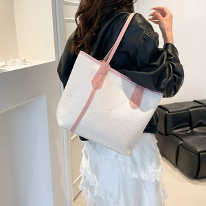 White and pink large tote bag with BABIER embossed pattern and shoulder straps