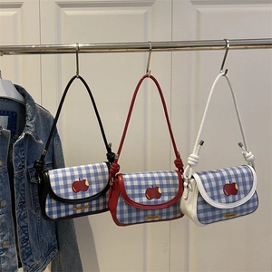 Three trendy plaid shoulder bags with red apple patches in black, red, and white trim