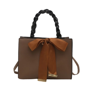 Retro brown square handbag with black woven handle and satin bow detail for women