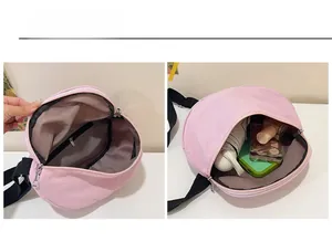 Interior view of pink crescent bag showing large capacity for umbrella and cosmetics