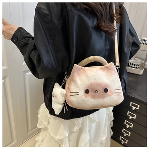 Detailed back view of a cute plush cat crossbody bag styled with a leather jacket