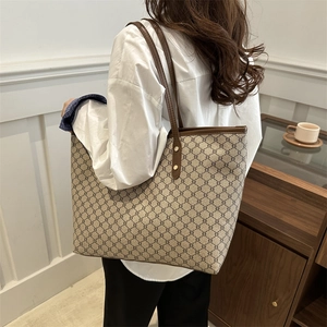 Minimalist vintage tote bag with brown monogram pattern for daily commuting and travel