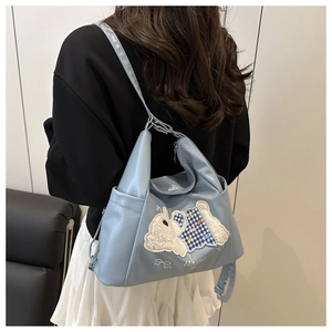 Back view of light blue PU leather shoulder bag with cute rabbit patch and embroidery