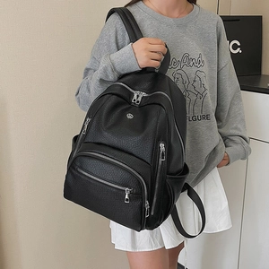 Minimalist black pebbled leather backpack for women stylish travel and school use