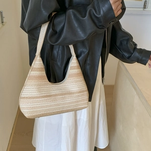 Striped woven straw shoulder bag with hobo silhouette for beach vacation or daily use