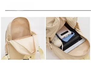 Internal layout showing large storage capacity of the cream nylon leisure backpack