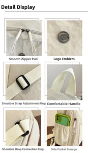Detail view of smooth dual zippers, logo, strap buckles and elastic side pockets of the bag
