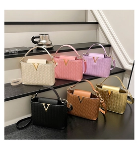 Detailed grid of woven textured crossbody bags in six colors with gold metal V logo
