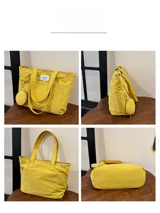 Detailed four-sided view of yellow canvas tote bag with matching round zipper pouch