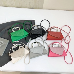 Metallic handle tote bag in multiple colors with textured flap and crossbody strap