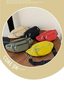 Detail of multi-compartment nylon belt bags in five colors with silver metal zippers