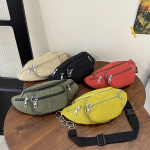 Versatile nylon crossbody waist bag in five colors with multi-zipper compartments