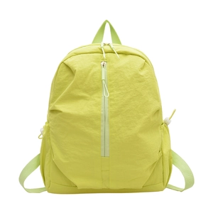 Minimalist light green nylon backpack with pleated texture and functional side pockets