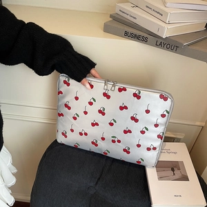Silver-grey laptop sleeve with red cherry print featuring double metal zippers