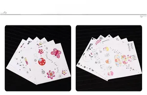 Detail of square mini greeting cards with colorful cartoon patterns and gold stamping