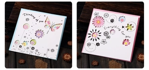 Macro detail of laser-cut hollow greeting cards with floral and butterfly patterns