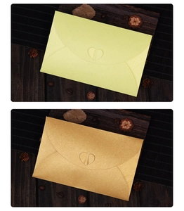 Detailed view of pearlescent envelopes featuring a unique heart-shaped closure and texture