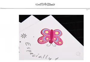 Macro detail of white gift card with hollow butterfly design and Especially For text