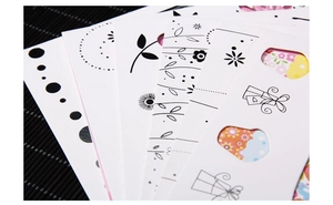 Detail of hollowed-out butterfly and floral greeting cards with silver foil stamping