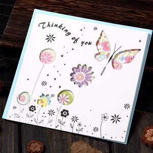 Laser-cut hollow greeting card with butterflies and flowers for holiday wishes