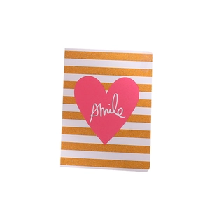 Creative greeting card with gold glitter stripes and a pink heart featuring Smile text