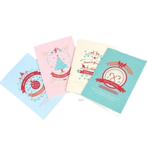 Set of eight Christmas greeting cards featuring reindeer and tree designs on matte paper