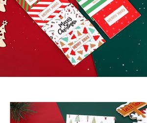 Detail of Christmas gift cards with Merry Xmas gold stamping and festive patterns