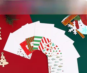 Detailed view of 8 assorted mini Christmas cards with festive patterns and gold foil envelopes