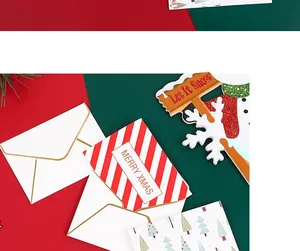 Detail of Christmas greeting cards set with gold foil envelopes and festive patterns