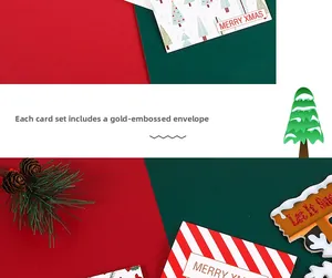 Close-up of 24PCS Christmas cards with gold foil envelopes and festive Santa patterns