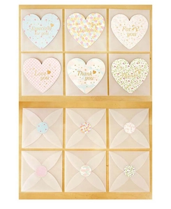 Detail of heart-shaped greeting cards with translucent envelopes and floral patterns