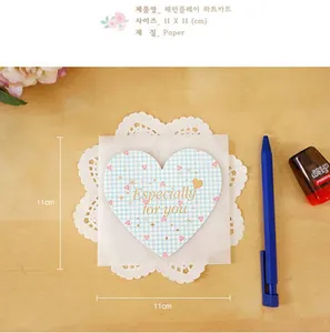 Macro shot of a light blue checkered heart card with 'Especially for you' gold lettering