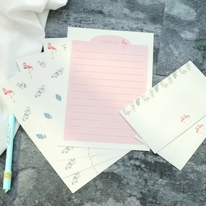 Floral flamingo stationery set with Aloha Days envelopes and paper on stone background