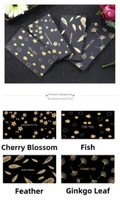 Macro detail of black business greeting cards featuring gold foil feathers and leaves