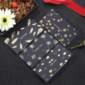 Elegant black and gold foil greeting cards with assorted patterns and luxury envelopes