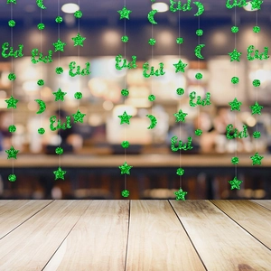 Green glittery Eid Mubarak hanging ornaments with stars and moon for festive party decor