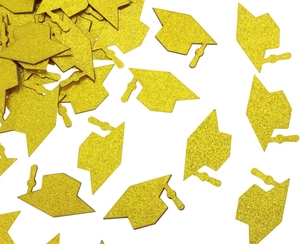 Close-up of glittery gold graduation cap confetti pieces on a white background