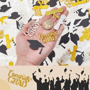 Glitter graduation table confetti with Congrats Grad text, diploma and cap shapes