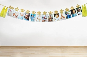 Detailed view of gold glitter star photo banner with Just Born tag for baby birthday