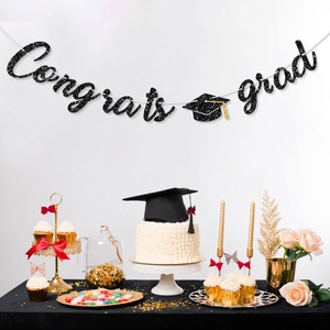 Black glitter Congrats Grad banner with gold tassel mortarboard for 2026 graduation decor