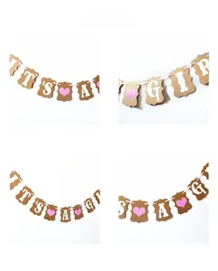 Close-up of It's a Girl banner with brown kraft paper cards and pink ribbon detail