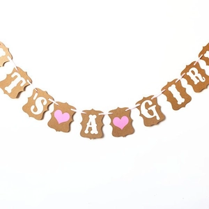 Brown kraft paper It's A Girl banner with pink ribbon for baby shower decorations