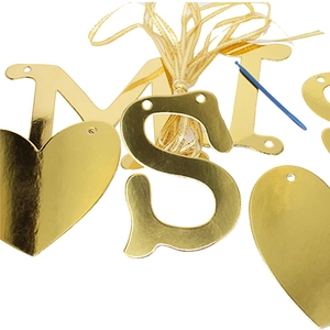 Gold mirror Miss to Mrs wedding banner letters with heart accents and ribbon